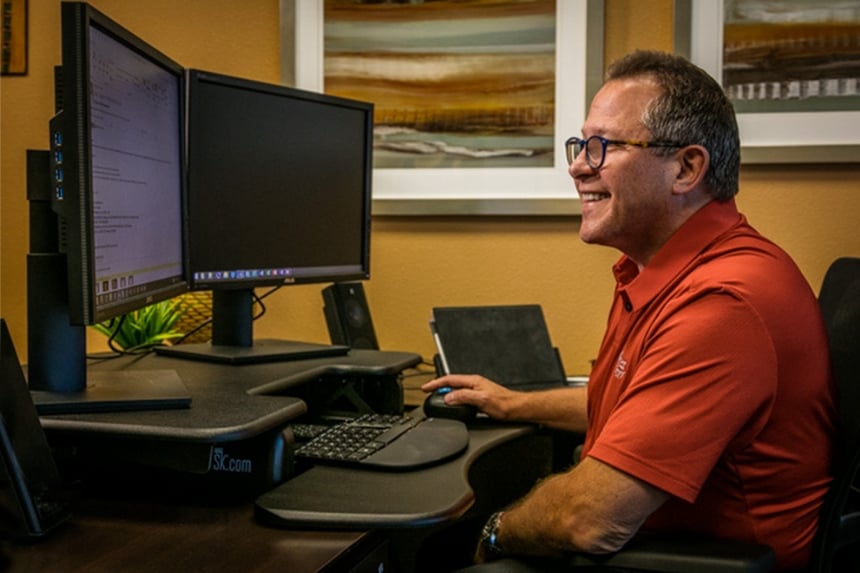 Rush employee working on computer