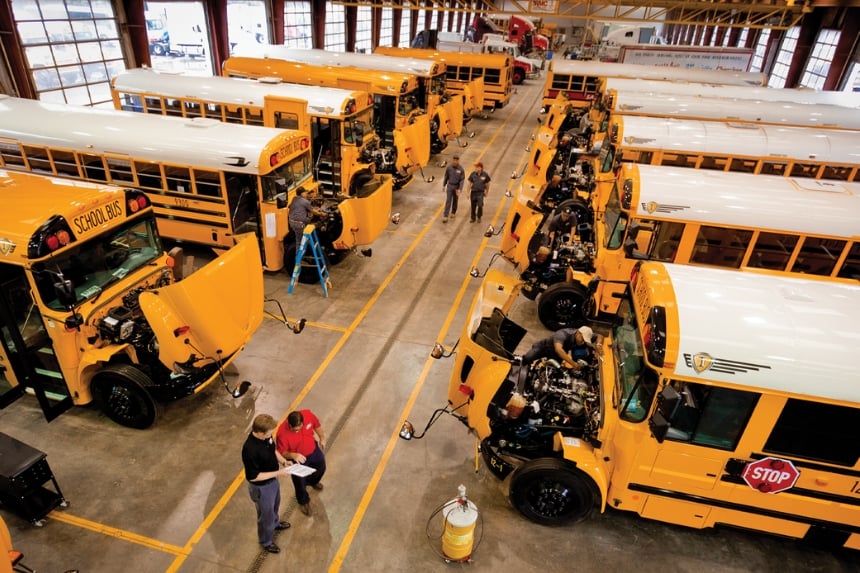 Rush Bus Centers service bays with yellow school buses