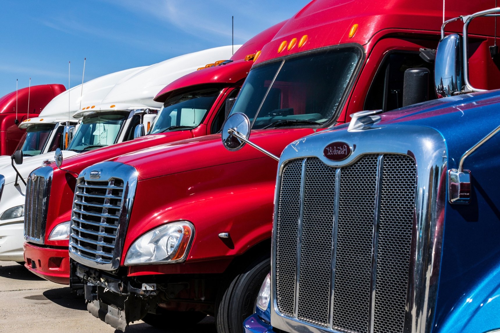Line up of used semi trucks