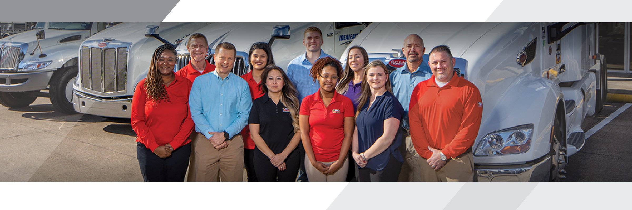 Group of Rush Truck Leasing employees standing in front of truck